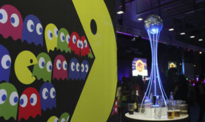 Pac man backdrop and mirror ball in an event theme